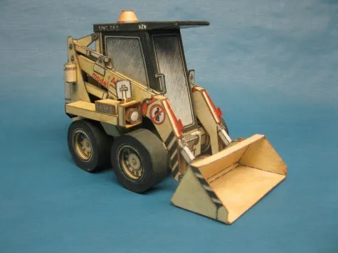 Papierový model Stavebný stroj - Čelný univerzálny nakladač UNC 060 - poškodene